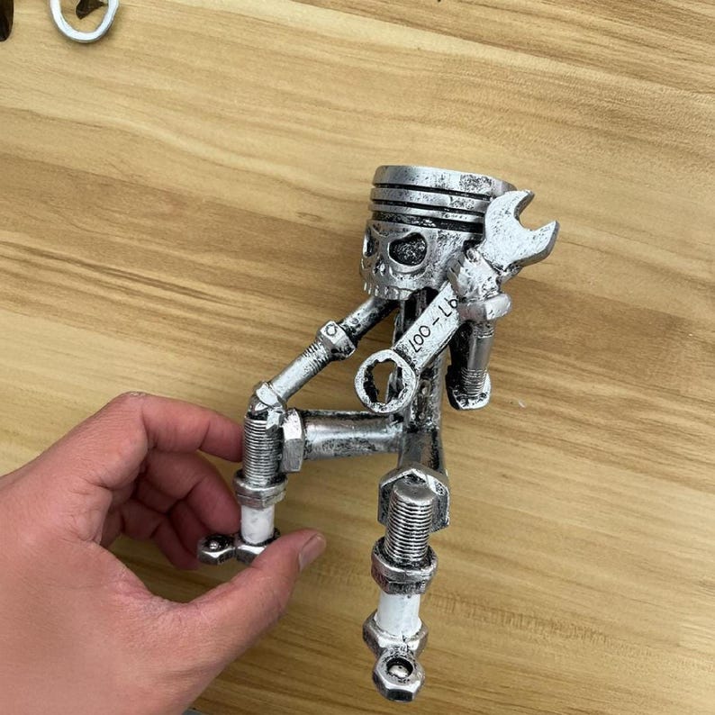 Piston Skull Resin Sculpture with Wrench Legs: Industrial Tabletop Decor for Car Enthusiasts