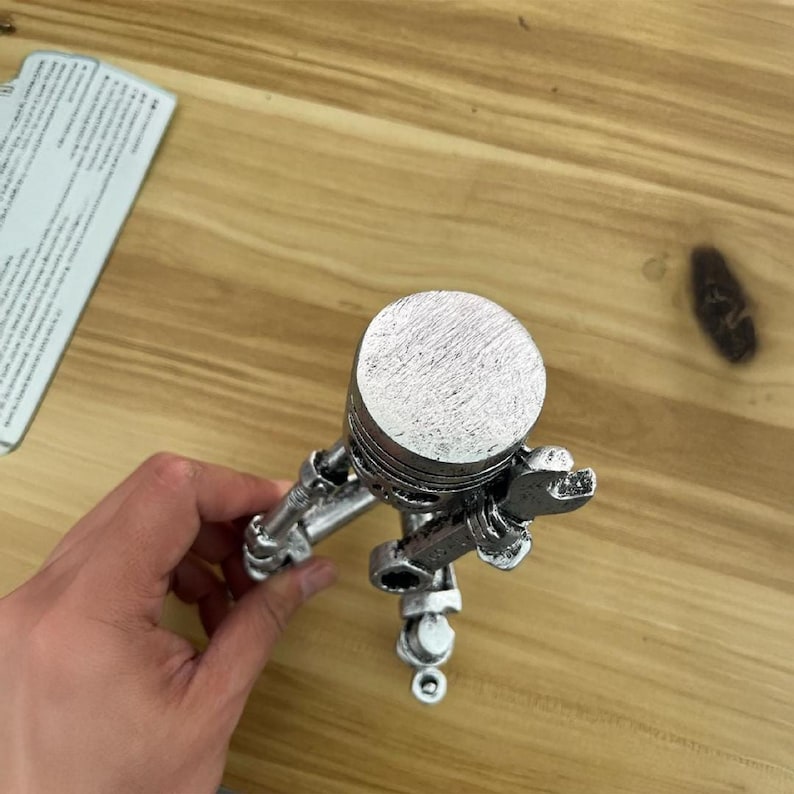 Piston Skull Resin Sculpture with Wrench Legs: Industrial Tabletop Decor for Car Enthusiasts