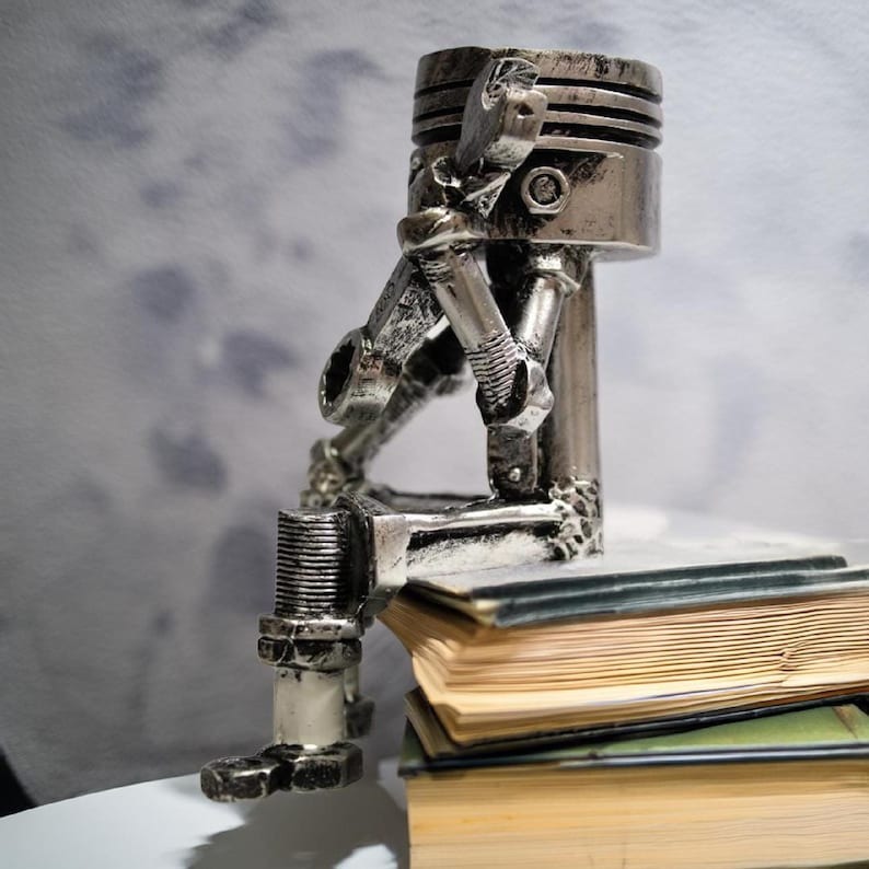 Piston Skull Resin Sculpture with Wrench Legs: Industrial Tabletop Decor for Car Enthusiasts